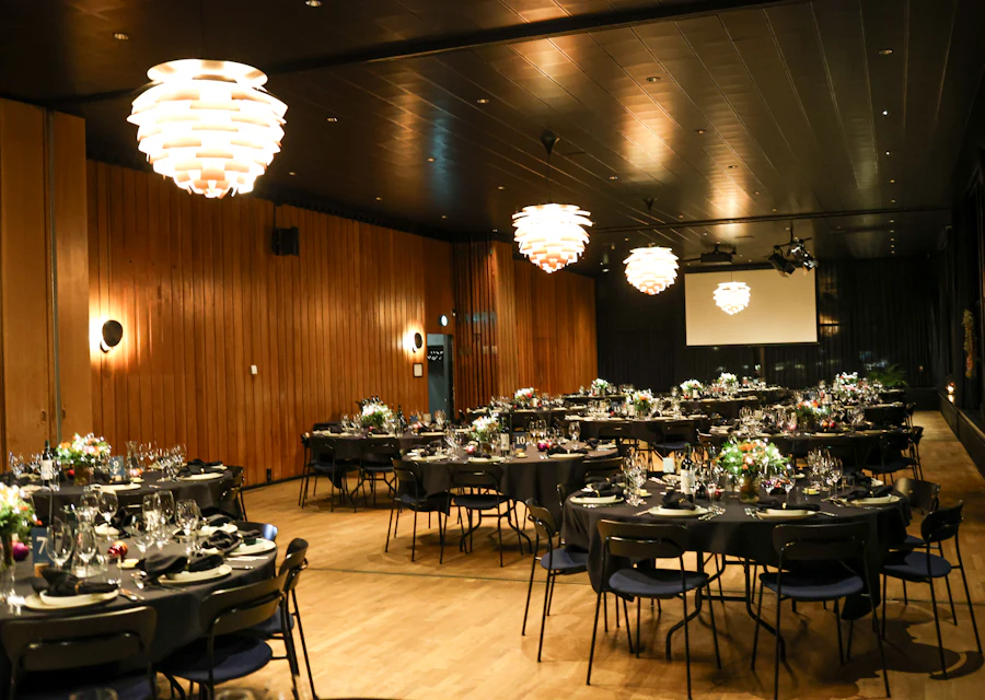 An elegant event space set with round tables